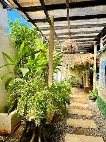 a patio with plants in a building at Panari Lodge El Nido in El Nido
