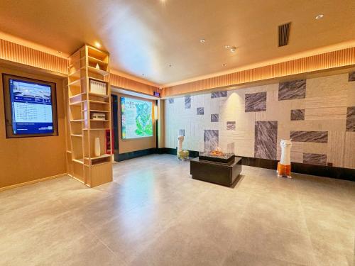 TV a/nebo společenská místnost v ubytování 奇遇九寨之悦酒店Adventure Jiuzhai Hyatt Hotel