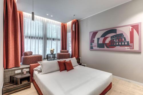 a bedroom with a bed and a large window at Parioli Cube Hotel in Rome