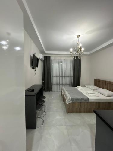 TV a/nebo společenská místnost v ubytování Giga Guest House