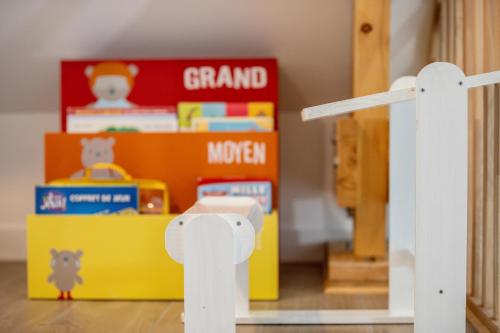 a toy room with a toy desk and a toy house at La Longere - Calme Neuf 15 min Amiens in Vers-sur-Celle