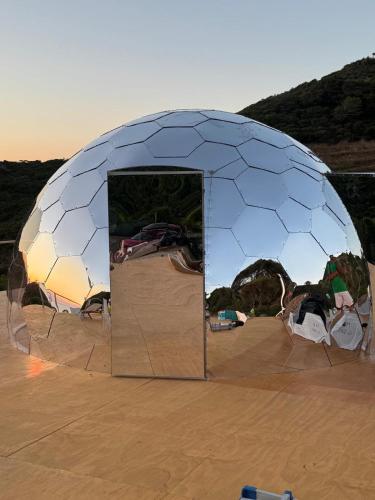 a large dome tent in the middle of the desert at Palmaria Sky Bubbles Room in Ponza
