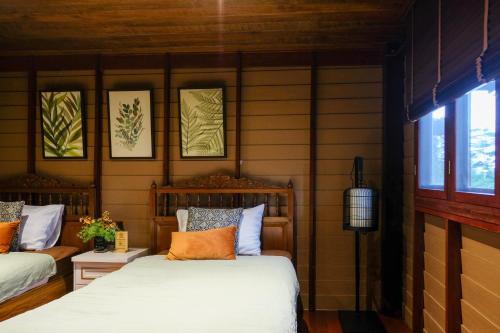 Postel nebo postele na pokoji v ubytování Suan Pa Khao Lom Homestay