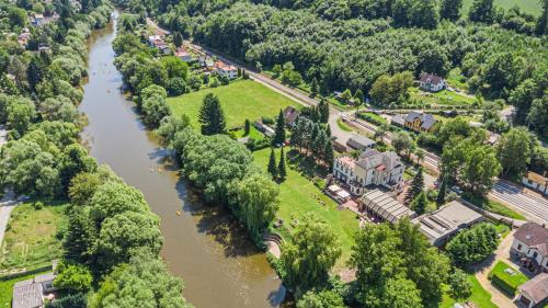 an aerial view of a town with a river at Hotel Samechov - konferenční hotel in Samechov