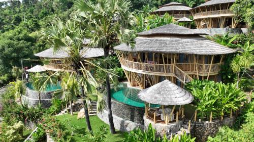an aerial view of a resort with a swimming pool at Villas Bukit Lipah in Amed