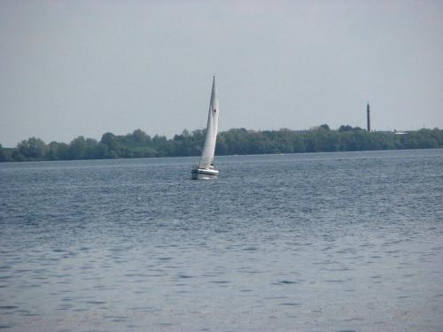 a sailboat in the middle of a large body of water at Kleiner Seezauber Bad Kleinen - ABC555 in Bad Kleinen