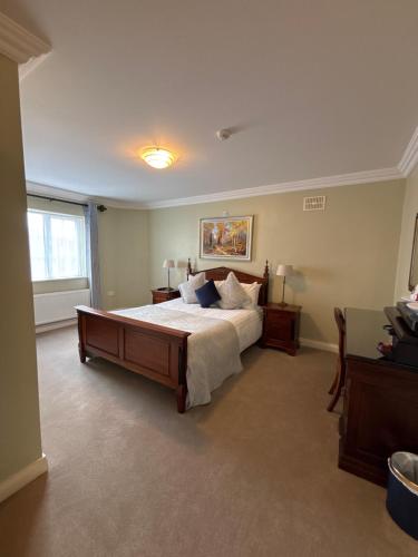a large bedroom with a bed and a window at The Fincourt B&B in Oldcastle