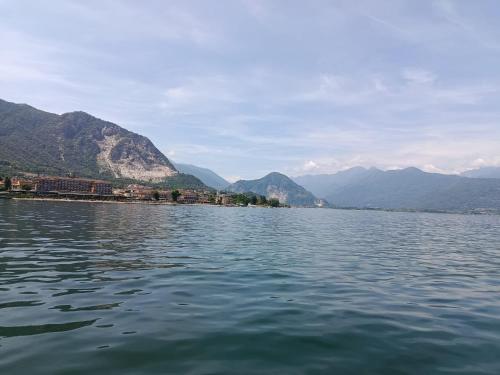 a large body of water with mountains in the background at PANORAMIC GREEN VALLEY in Sulzano
