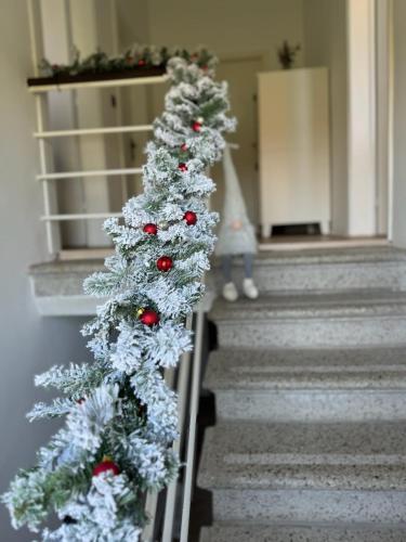a christmas tree on the stairs of a house at Casa Cabini Piave in Eraclea