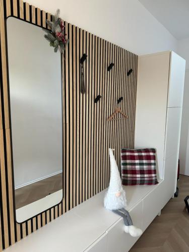 a bathroom with a mirror and a white cabinet at Casa Cabini Piave in Eraclea