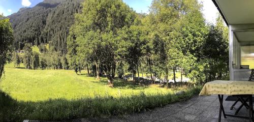 a view of a field and trees from a house at Ferienunterkunft Mit Zwei Schlafzimmern in Gortipohl
