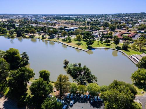 an aerial view of a lake with a bridge at Bendigo Signature Accommodation on Vine in Bendigo