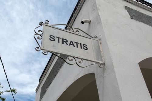 a street sign on the side of a building at Stratis Studios in Anaxos