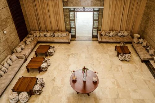an overhead view of a room with a table and couches at Treetop by Eight Continents, Zanzibar in Mchangani