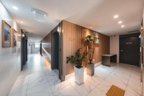 a hallway with a potted plant in a building at Hotel Palace Gyeongju in Gyeongju