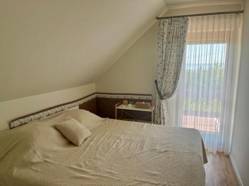 A bed or beds in a room at Panorama Vine House