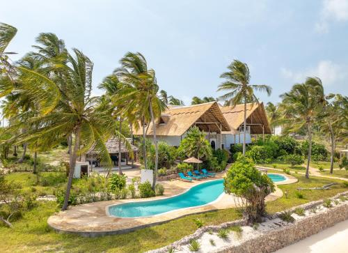 an aerial view of a resort with a swimming pool at Dar Beach House - Michamvi in Michamvi