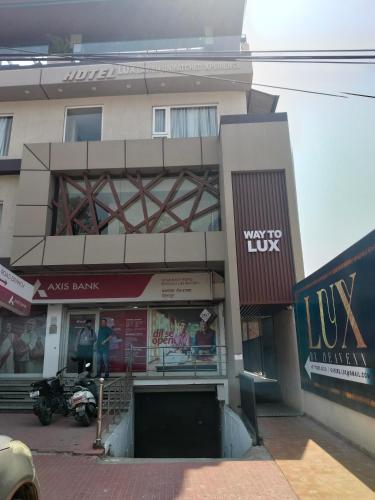 a building with a store in front of it at Hotel LUX by Heavenn in Dehradun