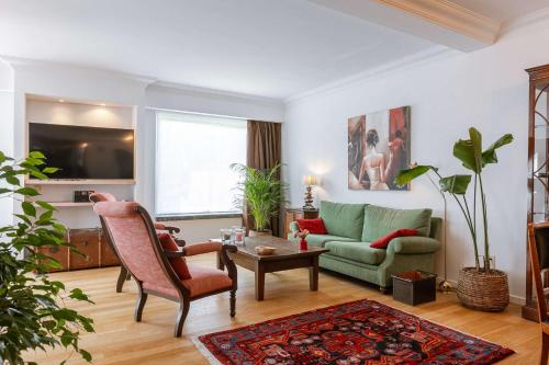 a living room with a couch and a table at Huswell - Lovely retreat for 2 in Antwerp in Antwerp