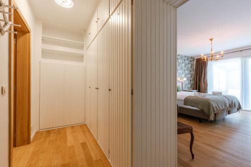 a bedroom with white walls and a bed in a room at Huswell - Lovely retreat for 2 in Antwerp in Antwerp