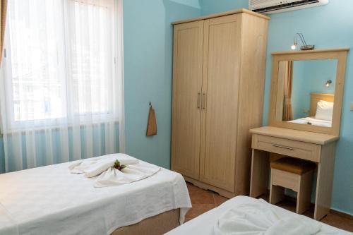 Ένα ή περισσότερα κρεβάτια σε δωμάτιο στο Lighthouse Apartments