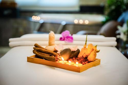 a plate of vegetables sitting on a table at Pearl River Hotel in Hai Phong