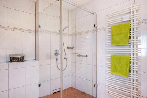 a bathroom with a shower with a glass door at Haus Gramespacher in Bad Bellingen