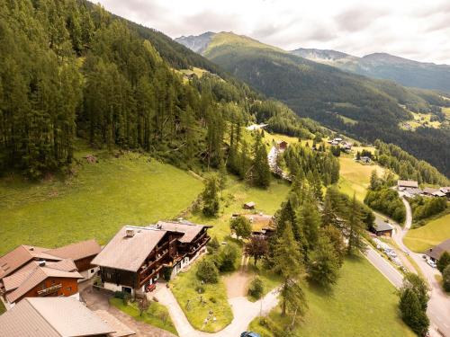 an aerial view of a resort in the mountains at Aparthotel Heiligenblut in Heiligenblut