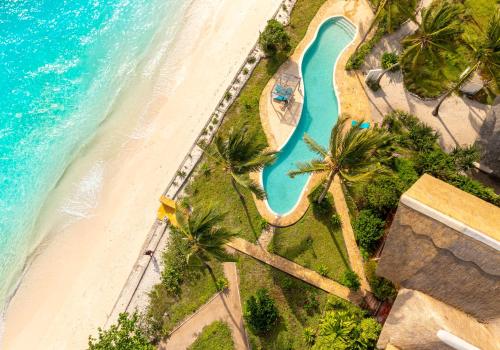 an aerial view of the beach and the ocean at Dar Beach House - Michamvi in Michamvi