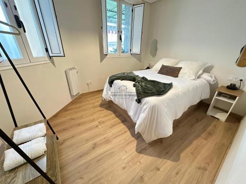 Postel nebo postele na pokoji v ubytování Hogar Forxa - Puente