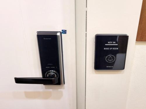 a door with a key card and a lock on it at Residence YeoYu in Incheon