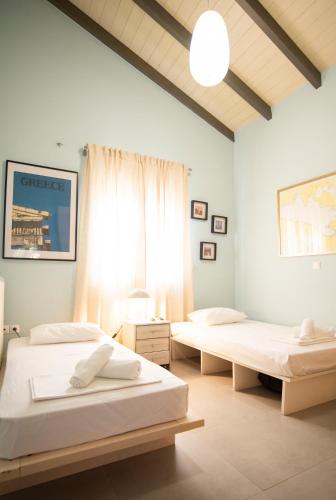 Postel nebo postele na pokoji v ubytování Glykorizo Country Villa, Assos Corinthia
