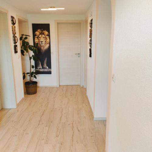 a hallway with a painting of a lion on the wall at Erholung in der Vulkaneifel in Kirchweiler