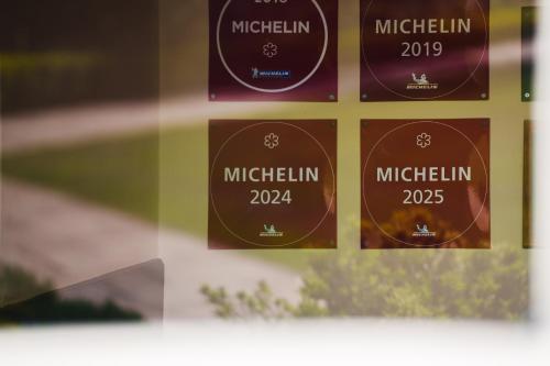 a glass window with labels for the michelin wines at Morston Hall in Holt