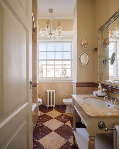 a bathroom with a sink and a toilet and a mirror at Valverde Sintra Palácio de Seteais - The Leading Hotels of the World in Sintra