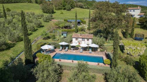 an aerial view of a villa with a swimming pool at Podere San Regolo in Scansano