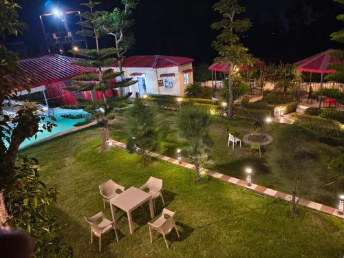 an aerial view of a backyard at night at Mohdev Resort in Jhājra