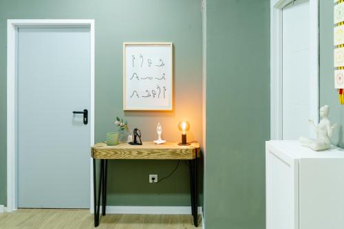 a room with a table with a candle on it at Hostel Time Life in Nerja