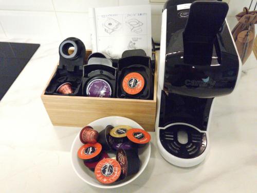 a food processor next to a box of cupcakes at Happy Inn Sweet Old Town Studio, Self check in, Parking in Vilnius