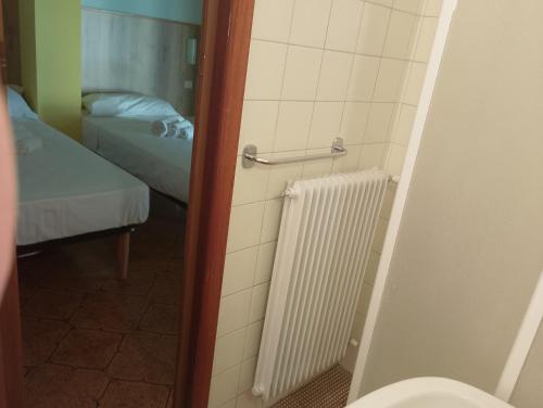 Postel nebo postele na pokoji v ubytování Hotel Garden