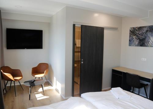Cama o camas de una habitación en Gistihúsið Hofsósi