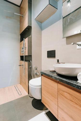 a bathroom with a sink and a toilet in it at Luxury Villas in Kireçhane