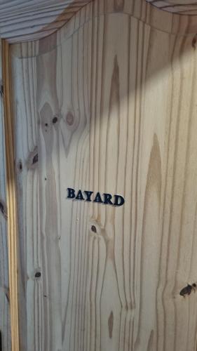 a wooden door with the word bayard written on it at L Orchidée in Dinant