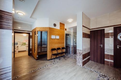 a room with a bar with chairs in it at Hotel Na Skarpie in Szklarska Poręba