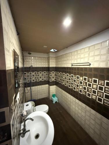 a bathroom with a sink and a toilet at Hotel HD Residency A Unit By Hotel Harbans in Patiāla