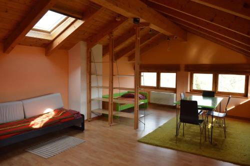 a room with a bed and a desk and a bed and a table at Cozy house near Asei with garden and terrace in Casa del Bosco