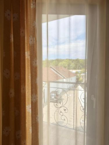 an open window with a view of a balcony at Casa Anamaria in Baile Felix