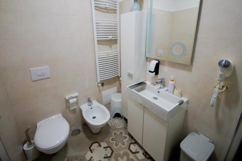 a small bathroom with a toilet and a sink at B&b Sant'Agata in SantʼAgata deʼ Goti