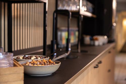two bowls of food sitting on a kitchen counter at Frederik VI's Hotel in Odense