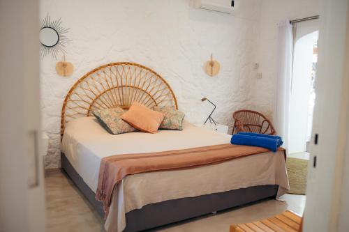 a bedroom with a large bed with pillows on it at Villa Opale in Trou d'Eau Douce